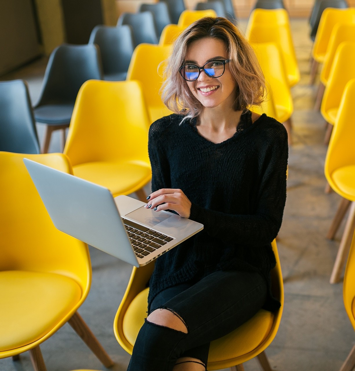 166012251280208-portrait-young-attractive-woman-sitting-lecture-hall-working-laptop-wearing-glas.jpg