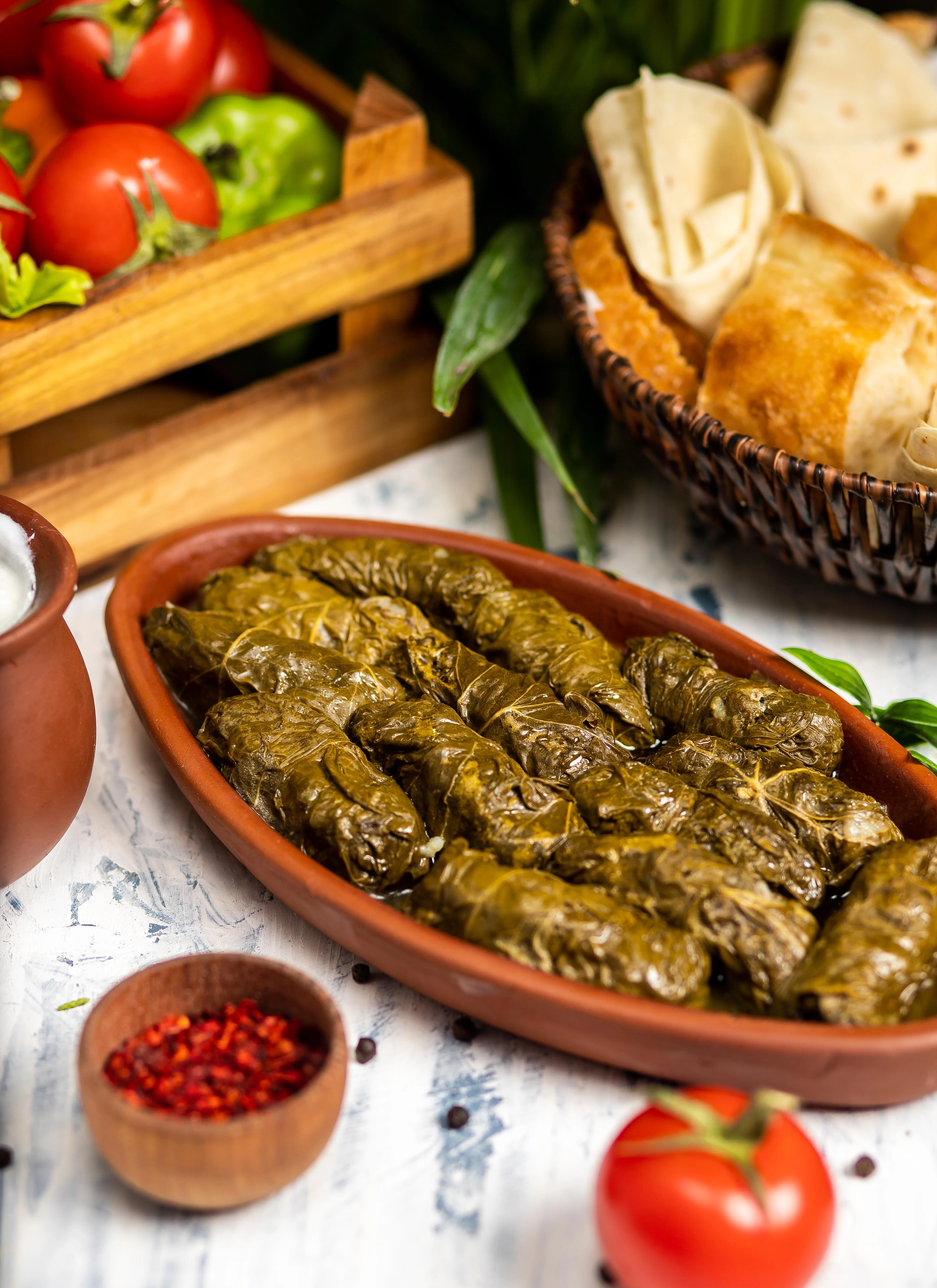 163-dolma-tolma-sarma-stuffed-grape-leaves-with-rice-meat-kitchen-table-with-yogurt--17040047464658.jpg