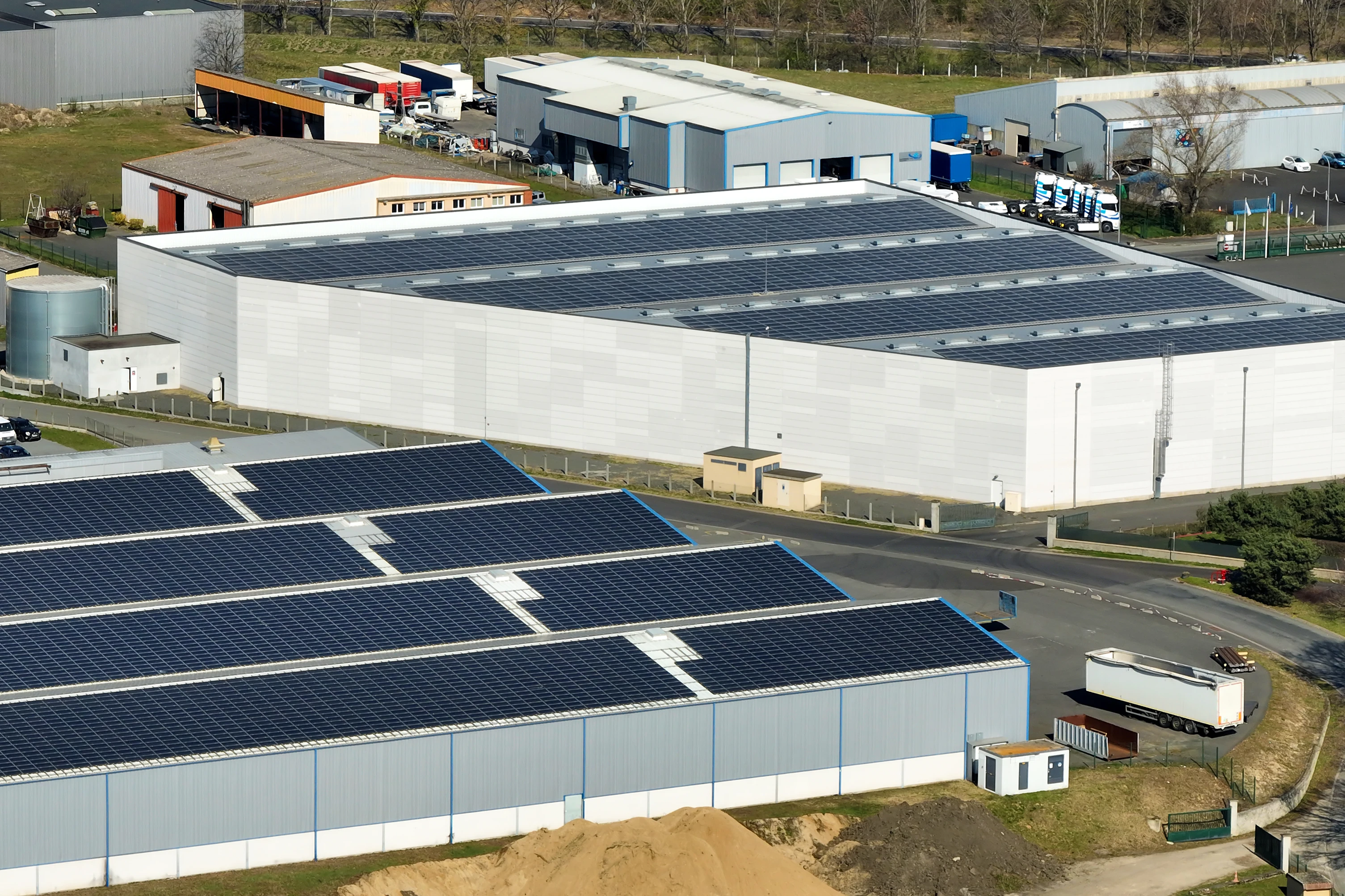 53-aerial-view-blue-photovoltaic-solar-panels-mounted-industrial-building-roof-prod-17383087293188.jpg