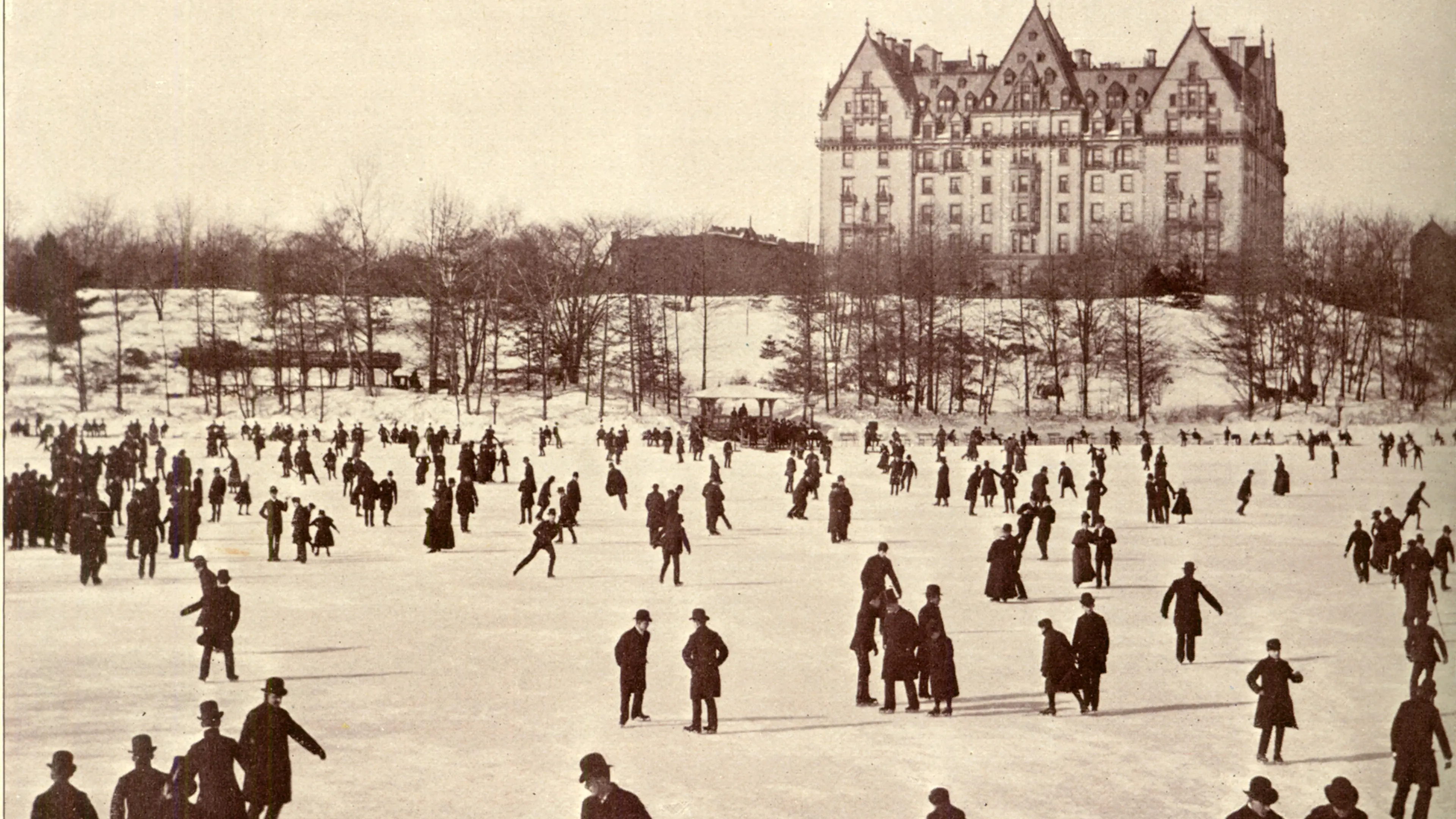 Skaters on the lake in Central Park. The Dakota dominated the scene.
