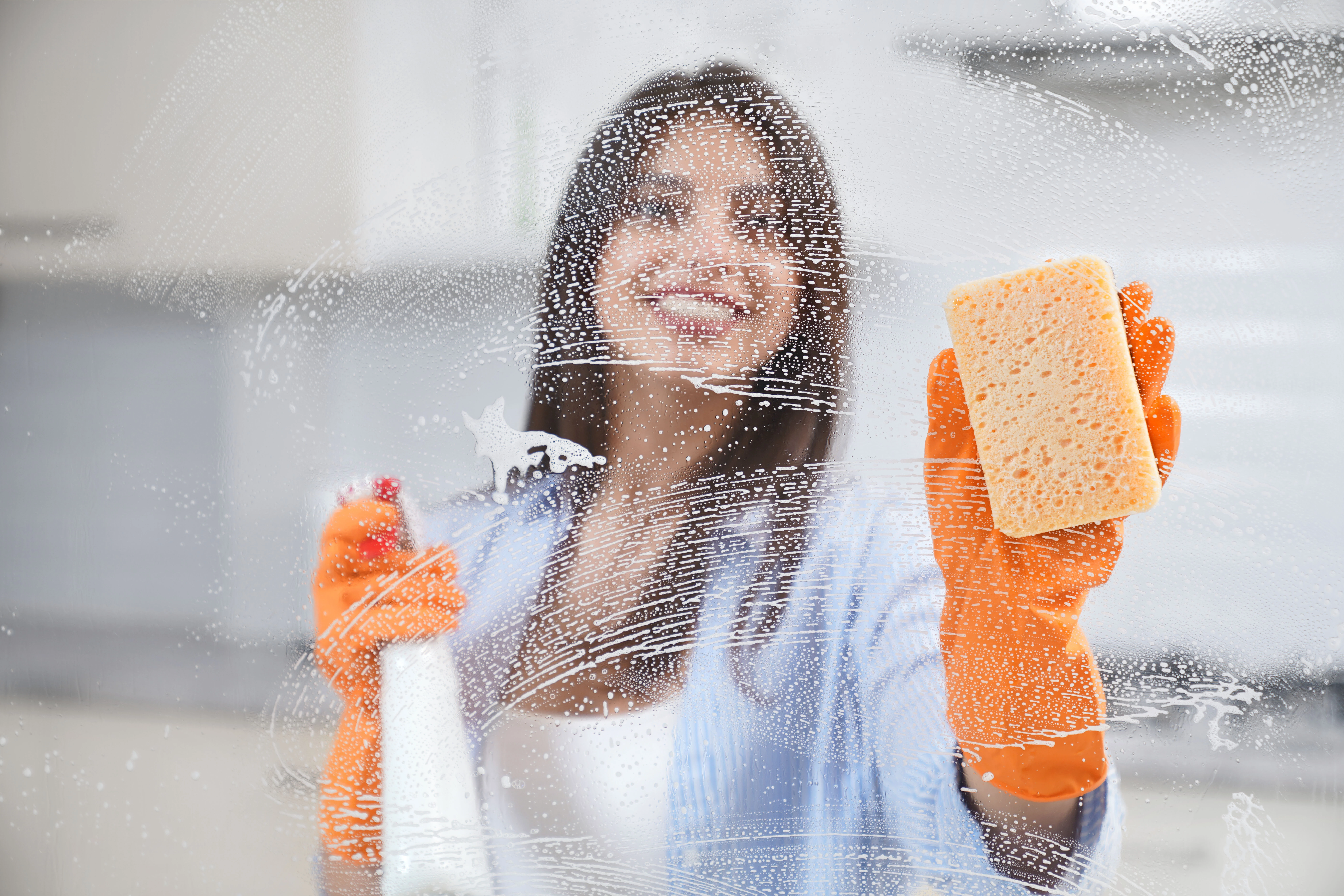 r79-beautiful-woman-washing-window-rubber-gloves-17407733482693.jpg