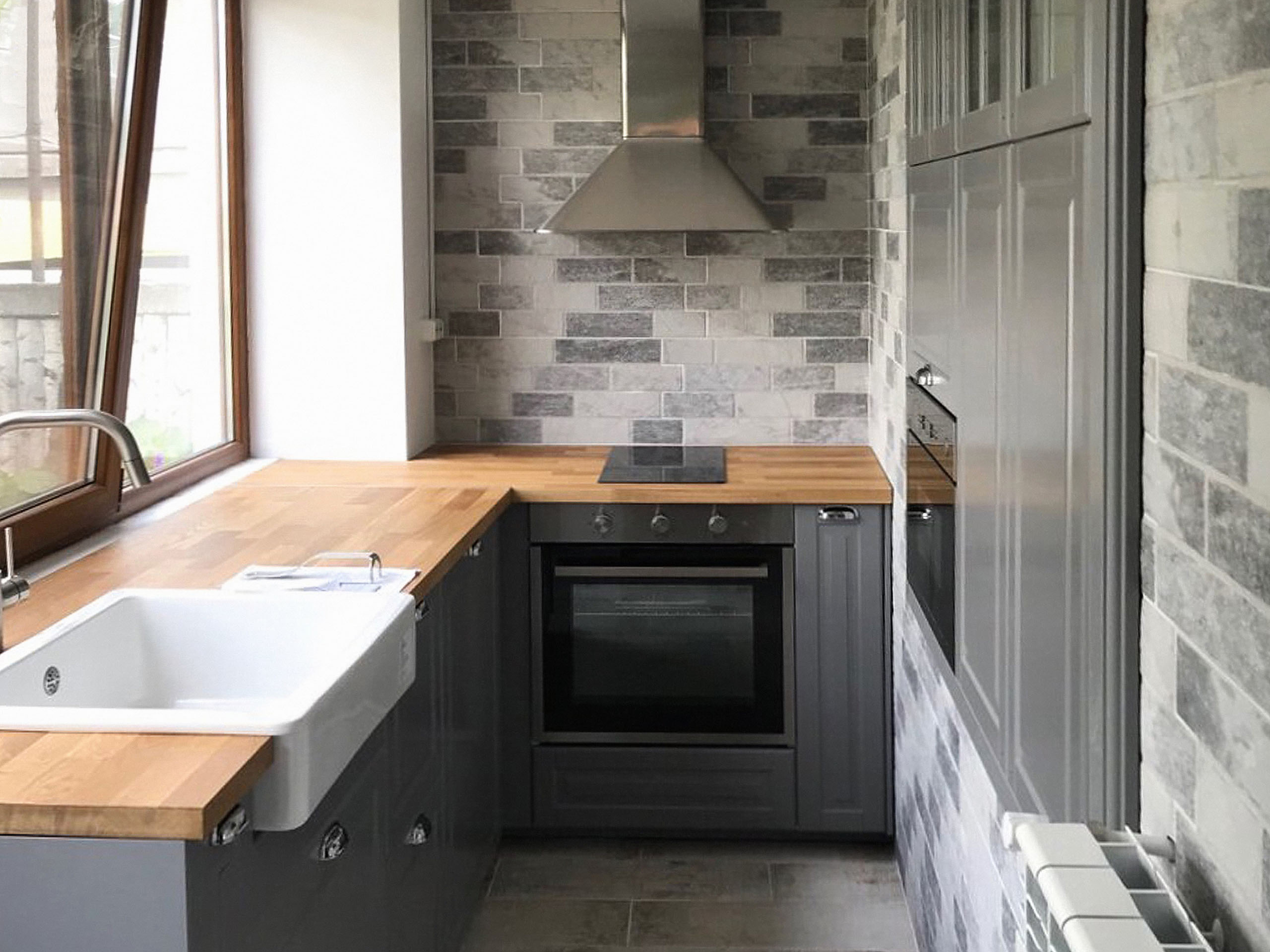 Dark grey BODBYN IKEA kitchen in a country style cottage