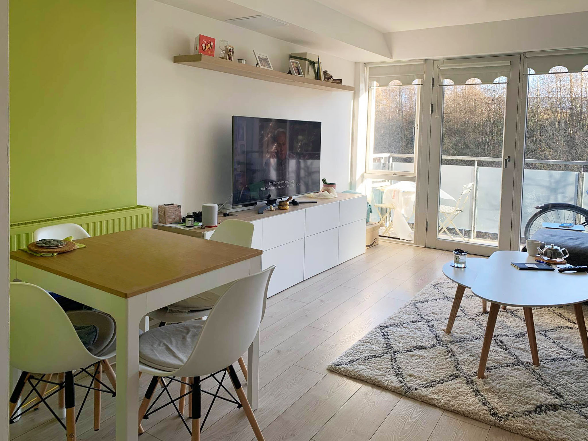 Green Living Room Tiny living room with small dining table in bright green