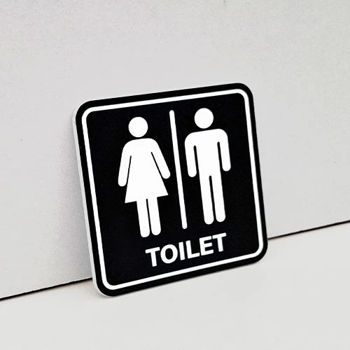 Лазерно изрязана и гравирана табела за тоалетна от черен акрил с квадратна форма с пиктограма на Мъж и Жена надпис Toilet.