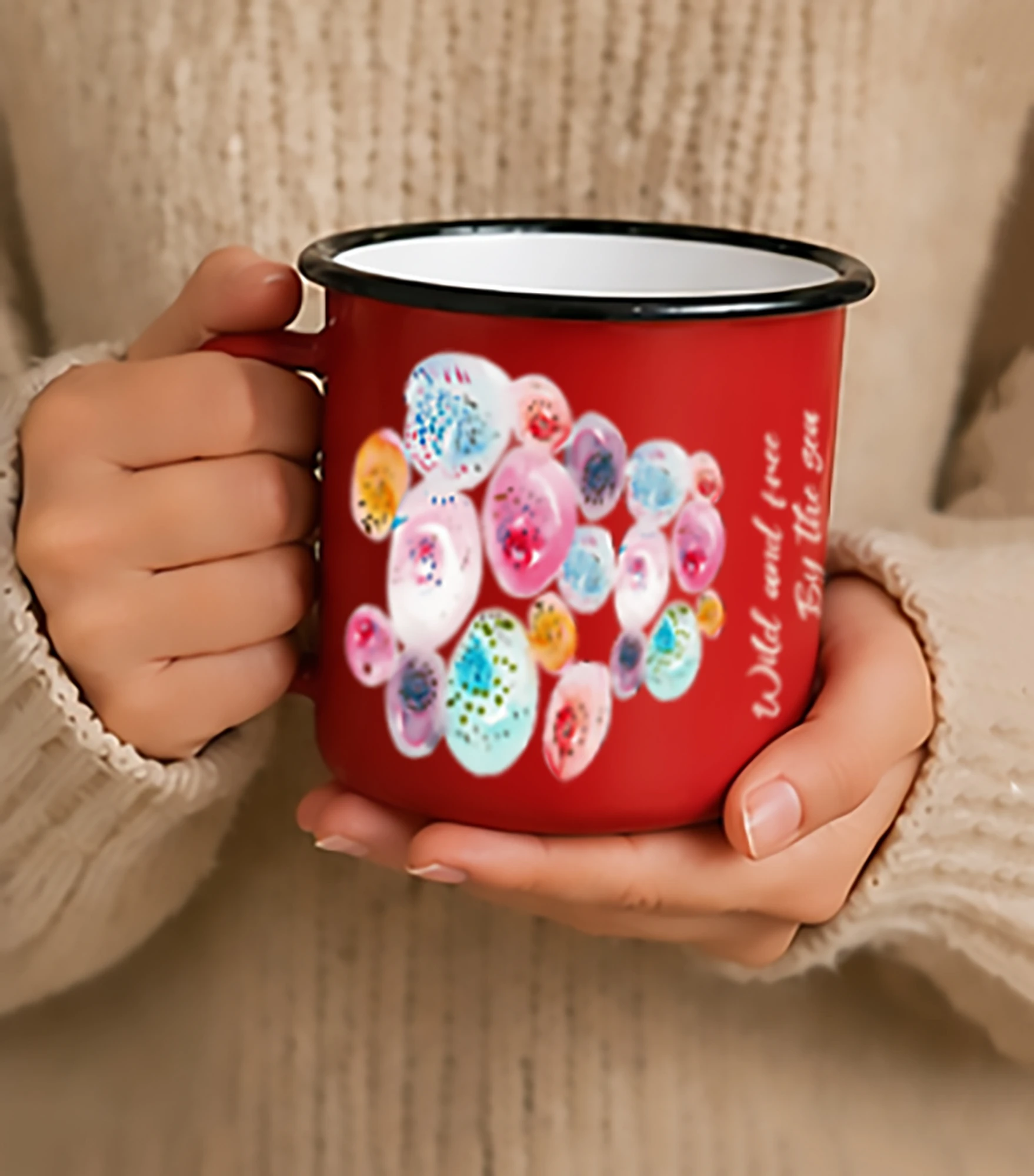 red enamel mug with bubble illustration and pale text
