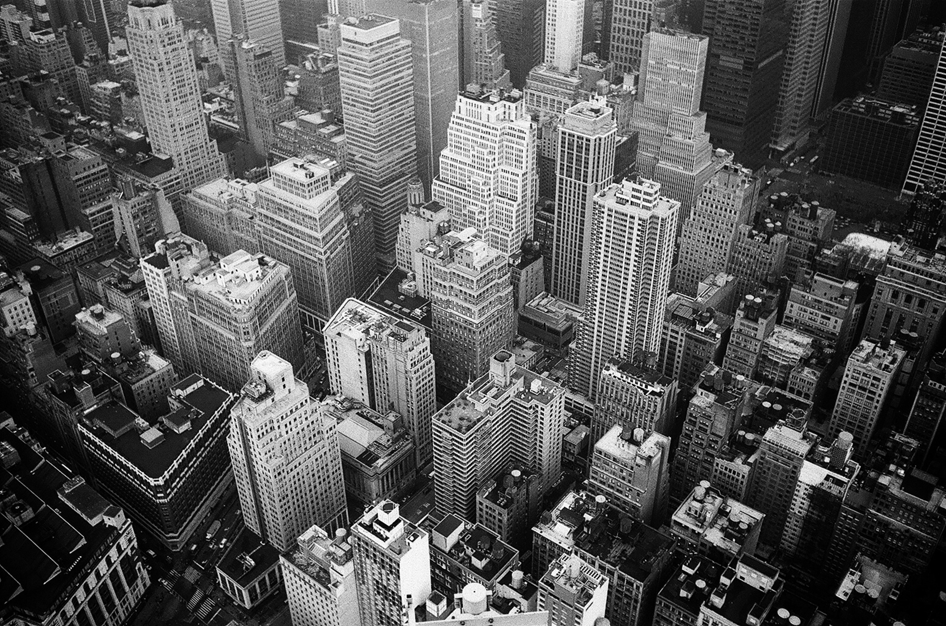r143-aerial-view-and-grayscale-photography-of-high-rise-buildings-1105766.jpg