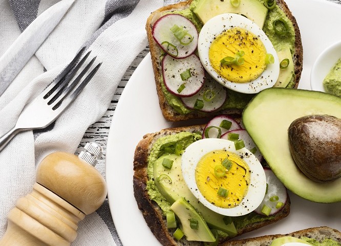 011566648225-2top-view-plate-with-egg-avocado-sandwiches-cutlery.jpg