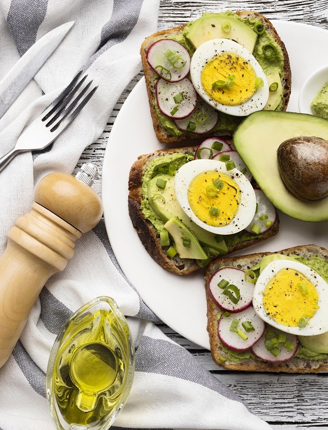06366687292-2top-view-plate-with-egg-avocado-sandwiches-cutlery.jpg