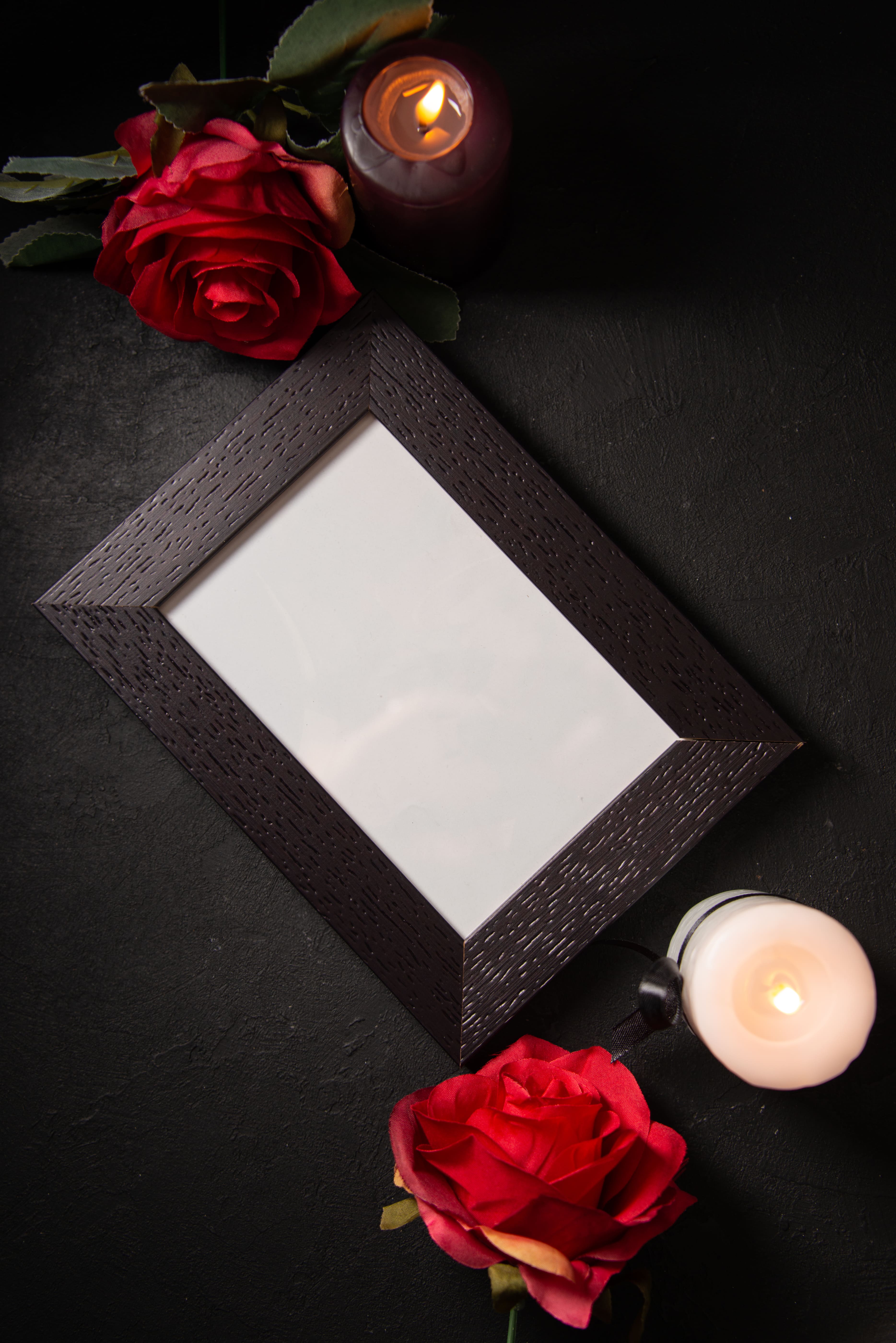 122-top-view-picture-frame-with-red-flowers-dark-wall-17684014140159.jpg