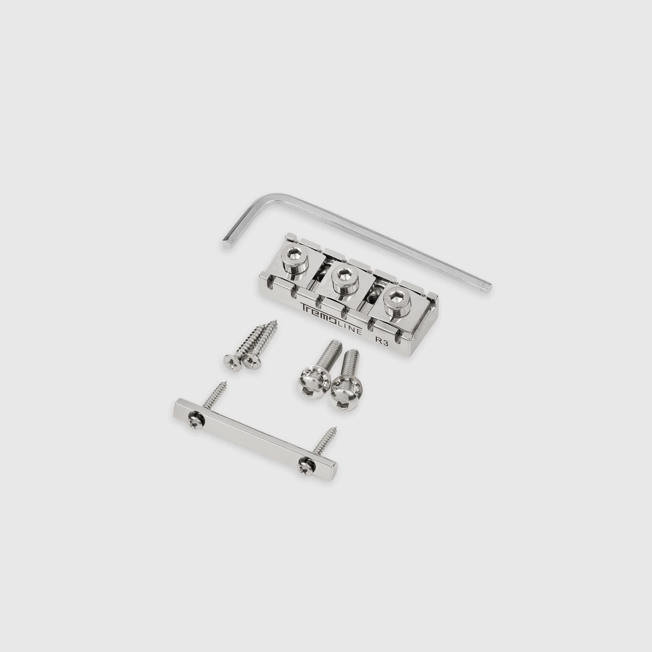<img src=”Tremoline-Tremolo-system-flat-top-FT36T-R3-SP_6” width="1280" height="1280" alt=”locking nut set of the Tremoline FT36T tremolo from the rear side” />