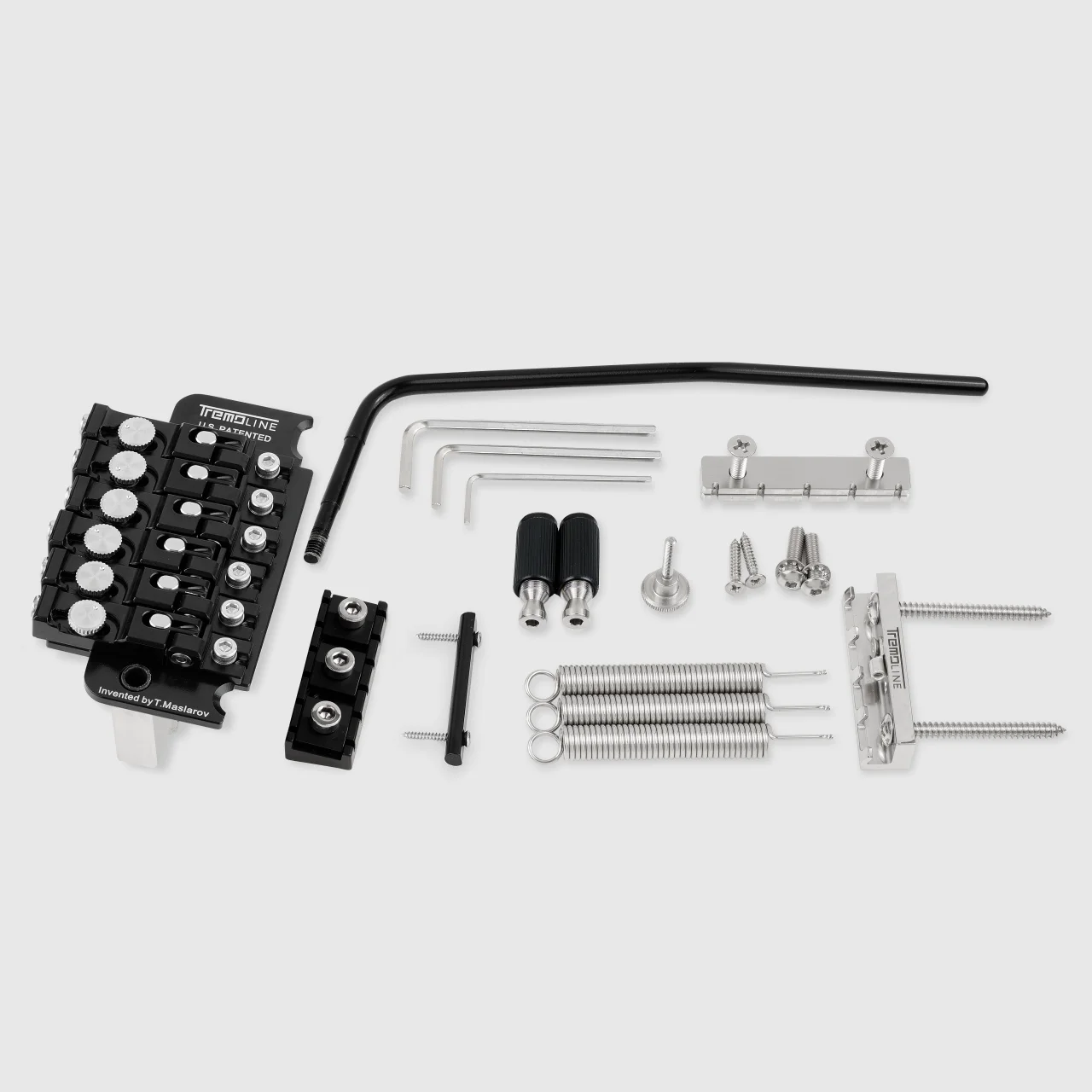 <img src=”Tremoline-Tremolo-system-FT36T-R3-BS-1280x1280-t03b” width="1280" height="1280" alt=”all parts of the black stainless steel tremolo set” />