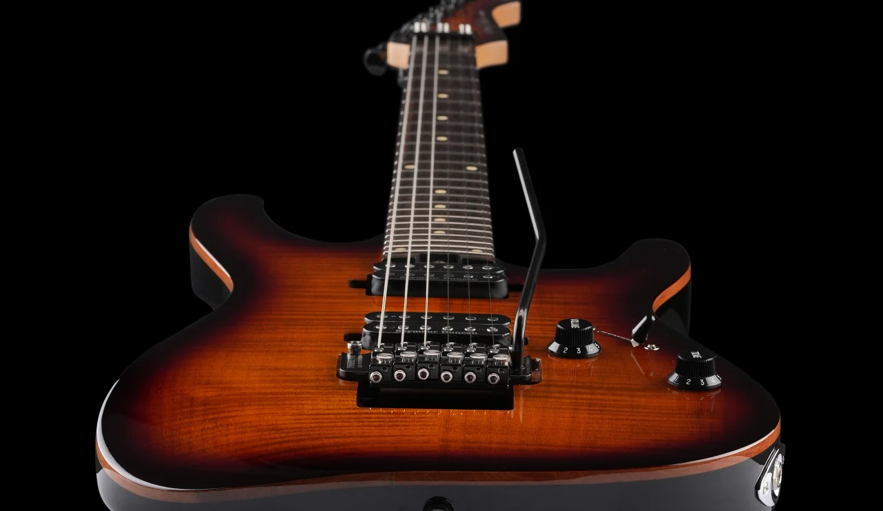 <img src=”Tremoline-FT36T-guitar-locking-tremolo-1280x741-S03A” width="1280" height="741" alt=”Tremoline FT36T locking tremolo on Harley Benton RH guitar” />