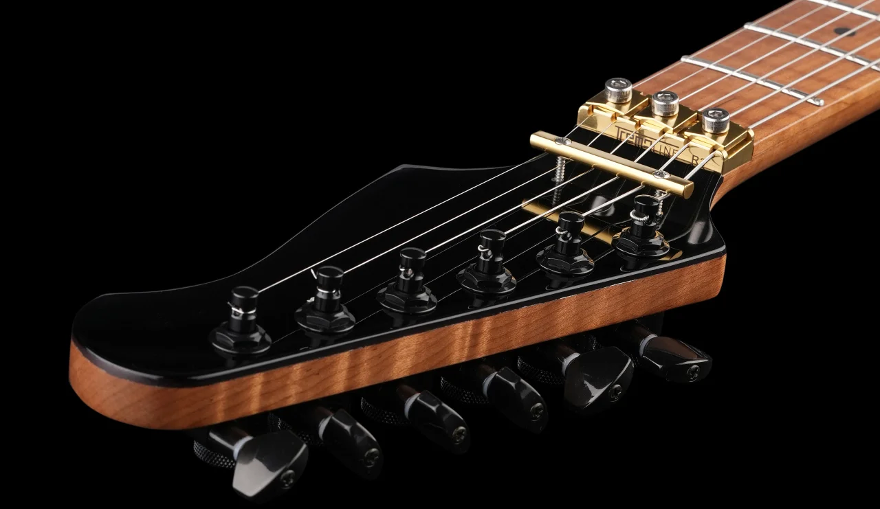 <img src=”Tremoline-FT36T-guitar-locking-tremolo-1280x741-S07A” width="1280" height="741" alt=”Tremoline FT36T locking nut on RH guitar” />