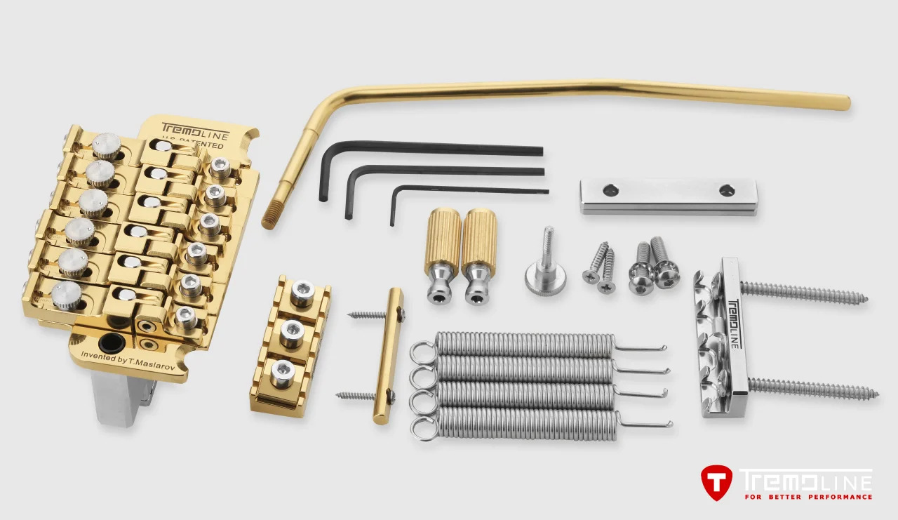 <img src=”Tremoline-FT36T-GOLD-guitar-locking-tremolo-1280x741-v01a” width="1280" height="741" alt=”Tremoline FT36T Gold locking tremolo set” />