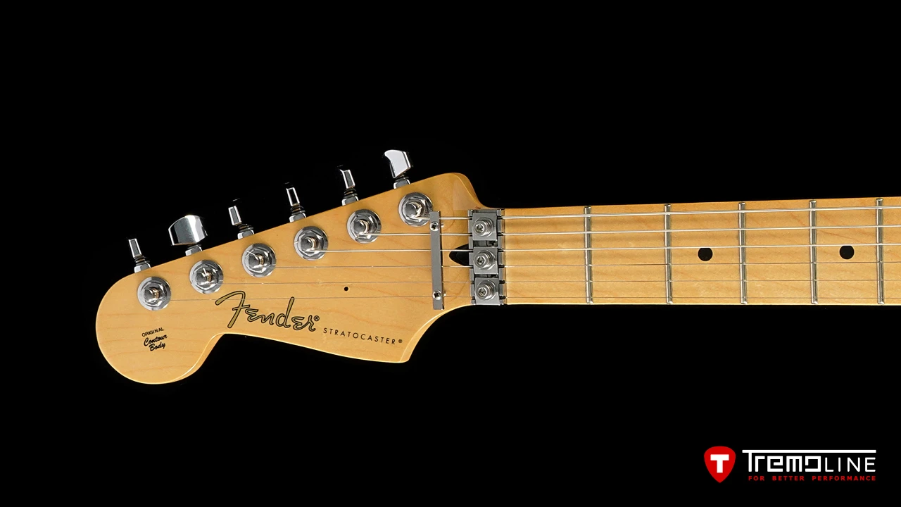 <img src=”Tremoline-guitar-double-locking-tremolo-Fender-Stratocaster-LH-1280x720-G2B.jpg” width="1280" height="720" alt=”Tremoline LN6A locking nut on Fender Stratocaster RH guitar” />