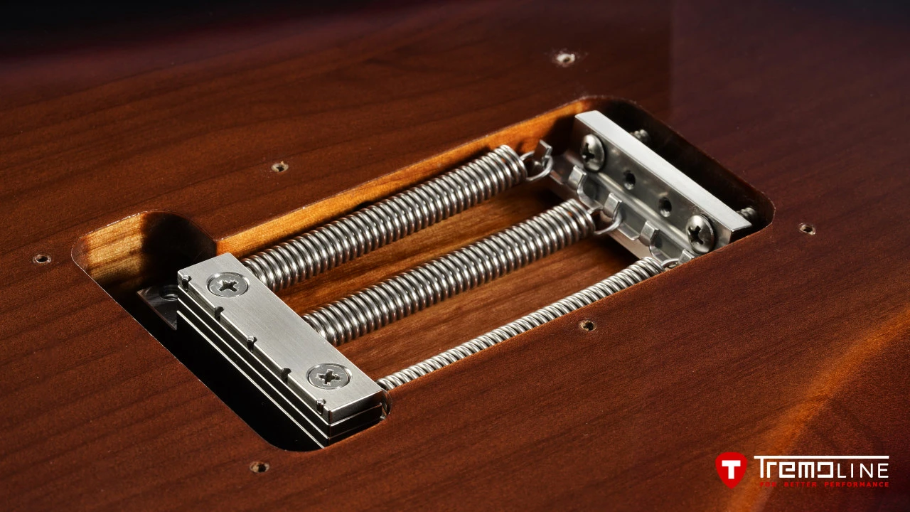 <img src=”Tremoline-guitar-double-locking-tremolo-Fender-Stratocaster-RH-1280x720-J2B.jpg” width="1280" height="720" alt=”Tremoline FT36M on Fender Stratocaster RH spring cavity” />