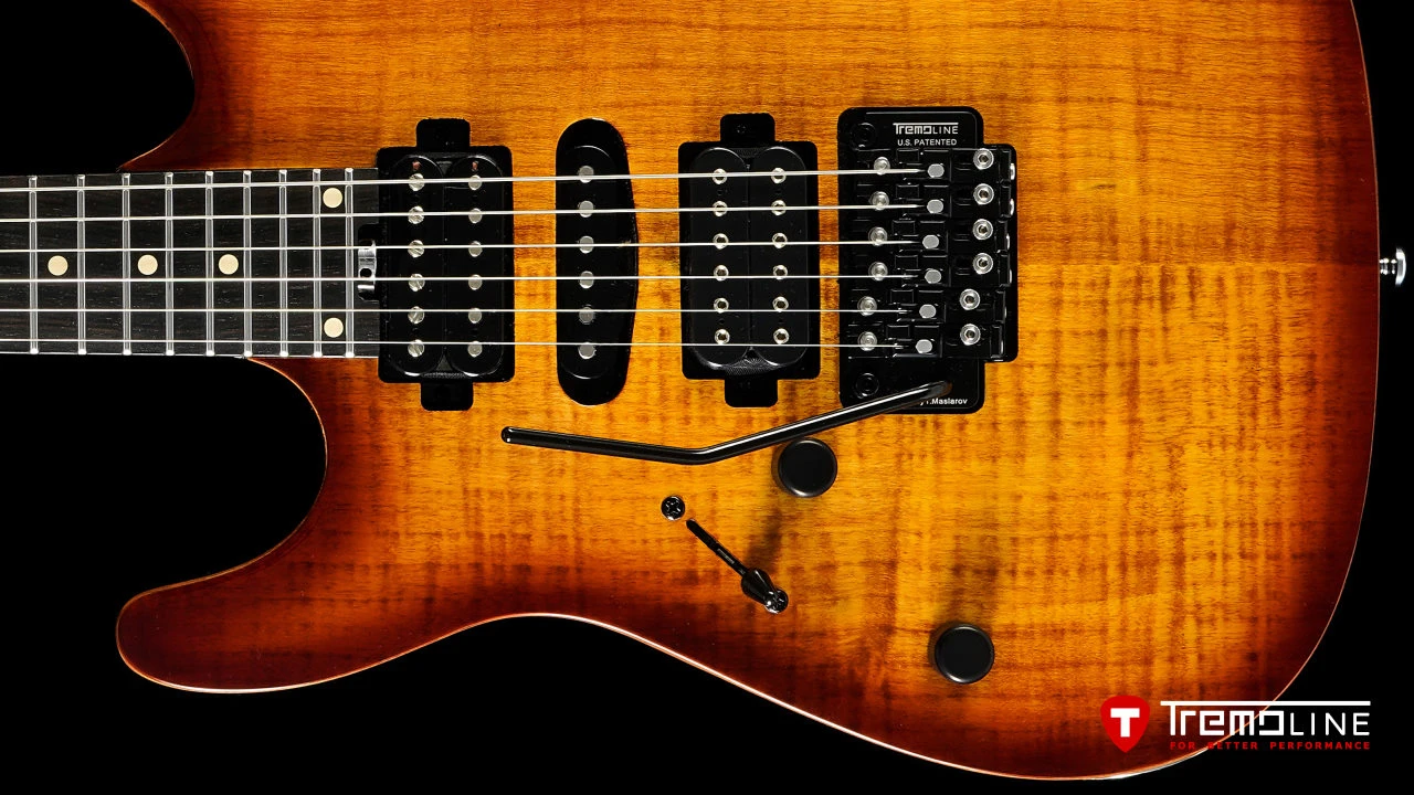 <img src=”Tremoline-guitar-double-locking-tremolo-Harley-Benton-Fusion-LH-1280x720-I1C.jpg” width="1280" height="720" alt=”Tremoline FT36M double locking tremolo on Harley Benton Fusion III LH guitar” />