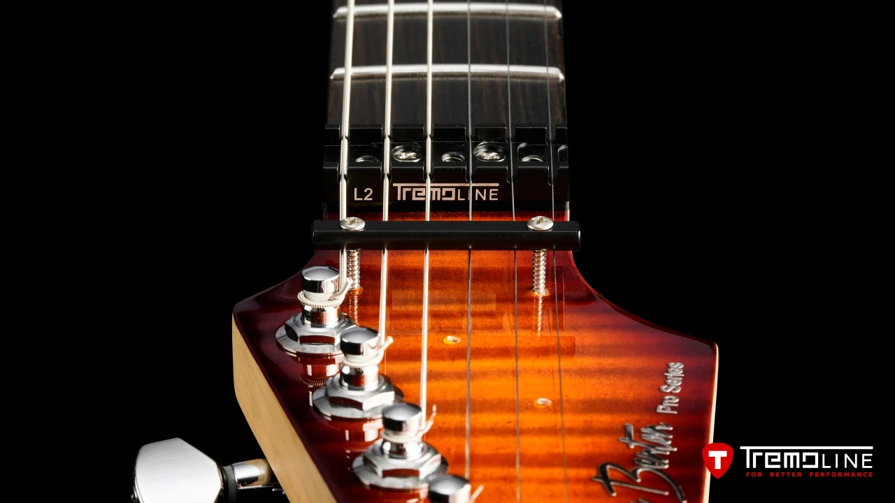<img src=”Tremoline-guitar-double-locking-tremolo-Harley-Benton-Fusion-LH-1280x720-I3B.jpg” width="1280" height="720" alt=”Tremoline LN6A locking nut on Harley Benton Fusion III LH guitar” />
