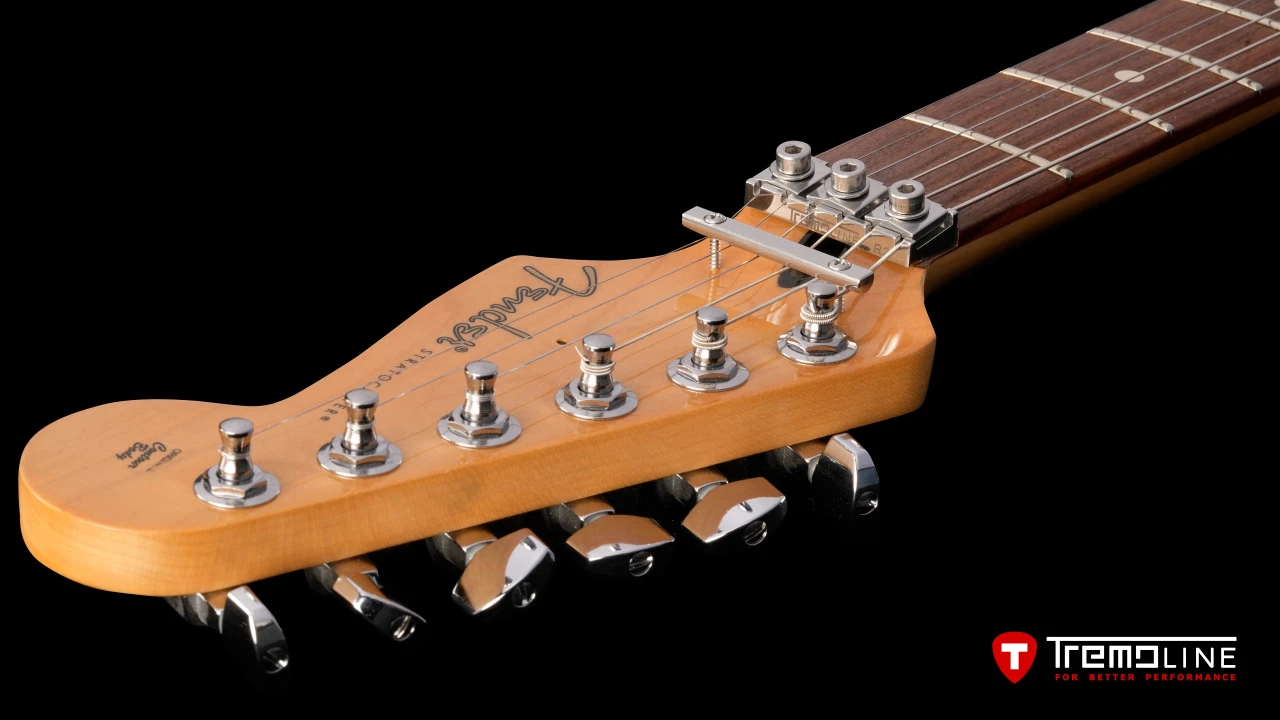 <img src=”Tremoline-guitar-tremolo-Fender-Stratocaster-RH-1280x720-09.jpg” width="1280" height="720" alt=”Tremoline LN6A locking nut on Fender Stratocaster RH guitar” />