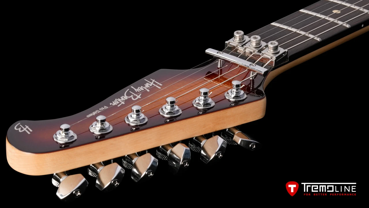 <img src=”Tremoline-guitar-tremolo-Harley-Benton-Fusion-RH-1280x720-06.jpg” width="1280" height="720" alt=”Tremoline LN6A locking nut on Harley Benton Fusion III RH guitar” />