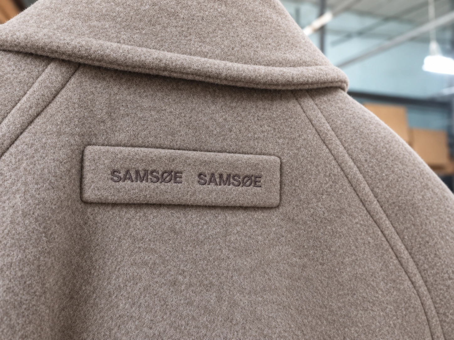 438-taupe-wool-coat-with-embroidered-branding-17916254483989.png