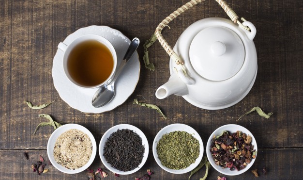 022626371412-herbal-tea-cup-teapot-with-bowls-tea-herbs-wooden-desk23-2148091994.jpg
