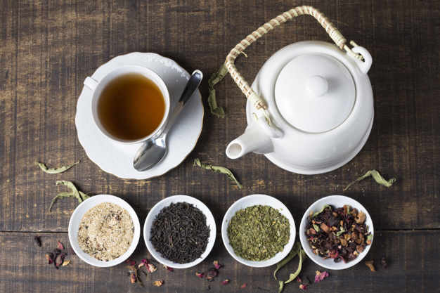 387-herbal-tea-cup-teapot-with-bowls-tea-herbs-wooden-desk23-2148091994.jpg